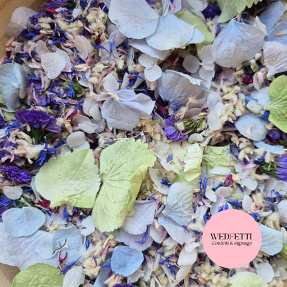 Colorful confetti mix with various flowers and leaves, branded 'WEDFETTI'.