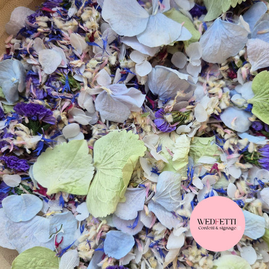 Colorful confetti mix with various flowers and leaves, branded 'WEDFETTI'.