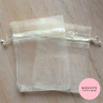Light beige sheer drawstring organza bags (empty)